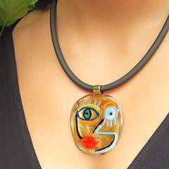 Model wearing CUBIST FACE 4 modern murano glass necklace, 24kt gold leaf pendant on black tubino, handmade in Italy
