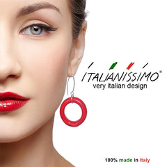 Model wearing CIRCOLO RED Murano glass circle dangle earrings with sterling silver wires, handmade in Italy