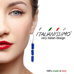 Model wearing TUBINO COBALT blue earrings with small silver-leaf murano beads and sterling silver wires, handmade in Italy