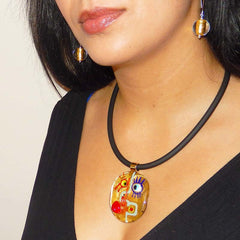Model wearing CUBIST FACE 2 modern 24kt gold leaf murano glass necklace and SPARKLE earrings, handmade in Italy
