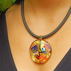 Model wearing CUBIST FACE 3 modern murano glass necklace, 24kt gold leaf pendant on black tubino, handmade in Italy