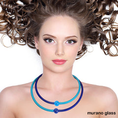 Model wearing two  TUBINO MURANO linkable NECKLACES in cobalt blue and aqua, luxurious hypoallergenic synthetic rubber with handmade murano glass links, easily cut to size, Made in Italy