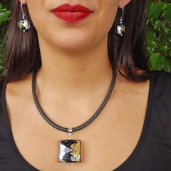 Model wearing GLITTER SQUARE BLACK modern murano glass necklace and GLITTER BLACK earrings, handmade in Italy